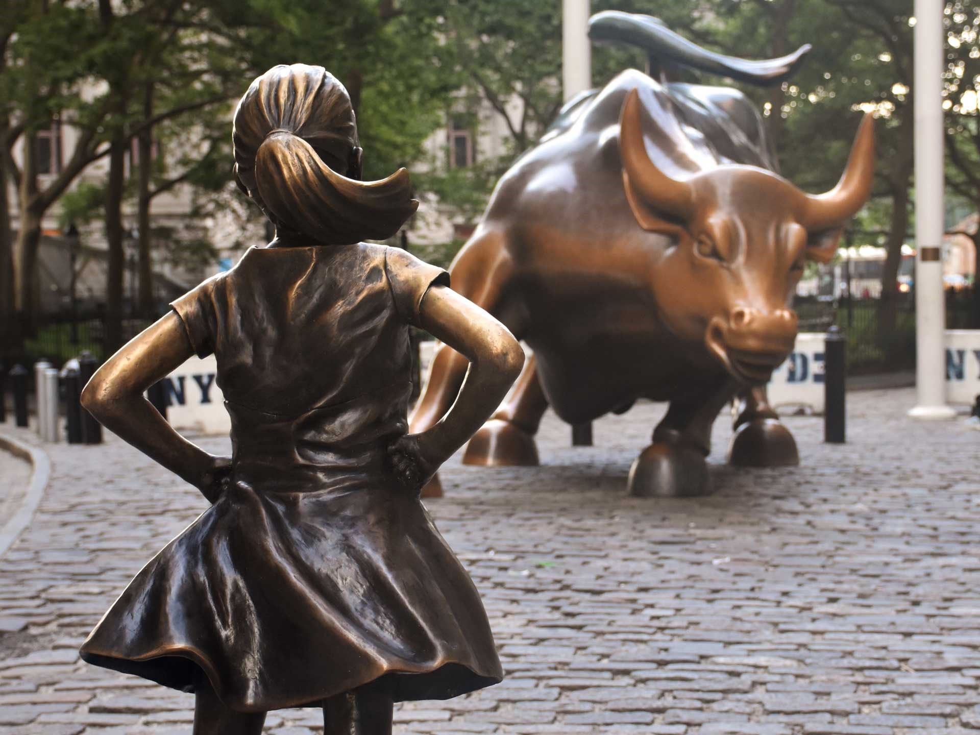 Wall street bull with girl